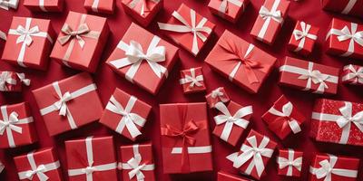 The primary subject of the image is a large number of red and white presents. The presents are arranged in various positions, creating a visually appealing and festive scene. The setting is a red background, which adds to the overall atmosphere of the image. The visual style is a combination of photo and digital art, creating a realistic yet artistic representation of the presents. The colors and mood of the image are predominantly red and white, evoking a sense of warmth, joy, and celebration.